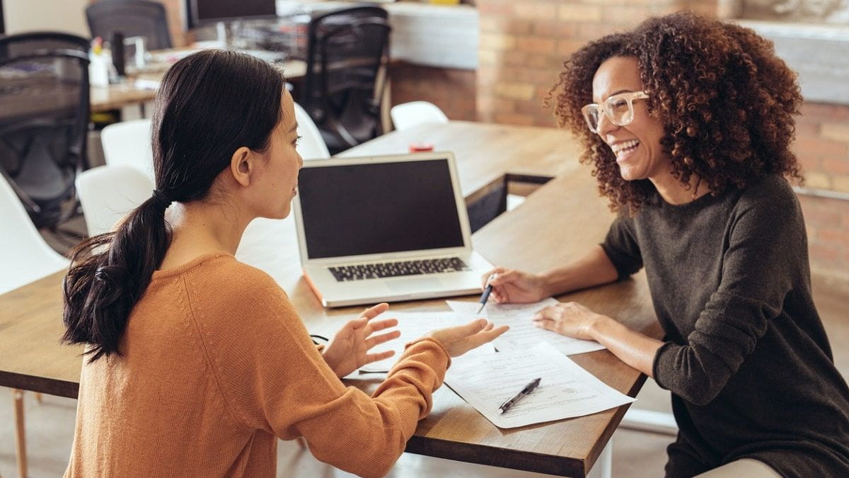 female mentor advising student