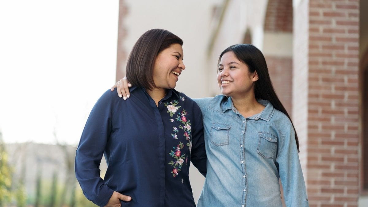 Mom and daughter smiling